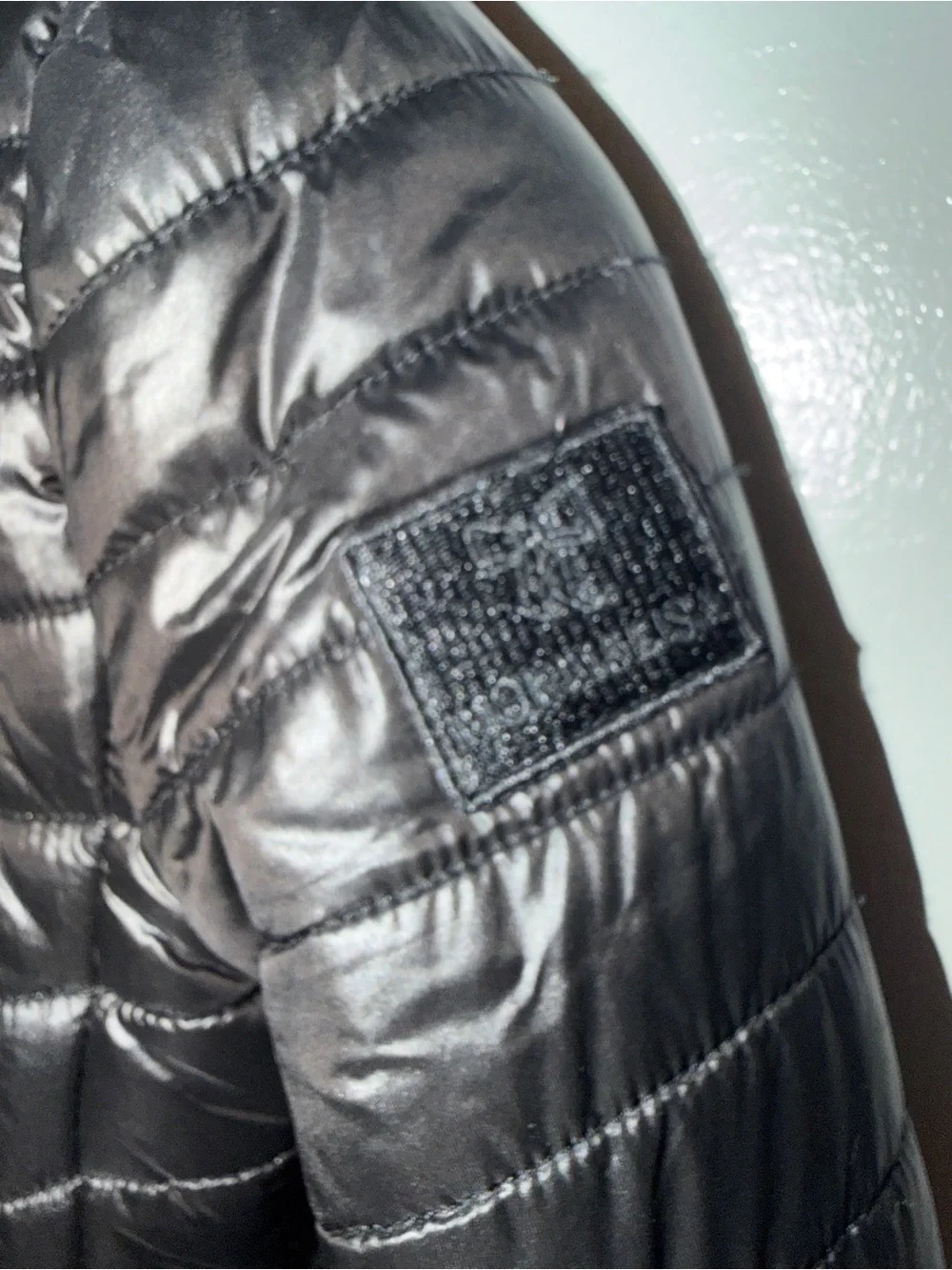 Women's Black Quilted Puffer Jacket with Embellished Neckline